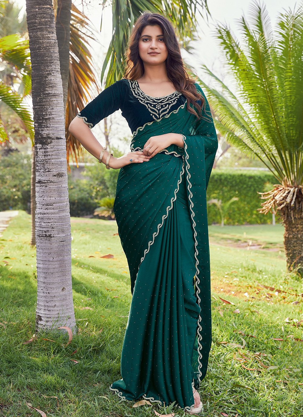 A plain design pata saree in Green colour with blouse piece.