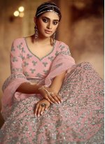 Conspicuous Net Embroidered Pink Lehenga Choli