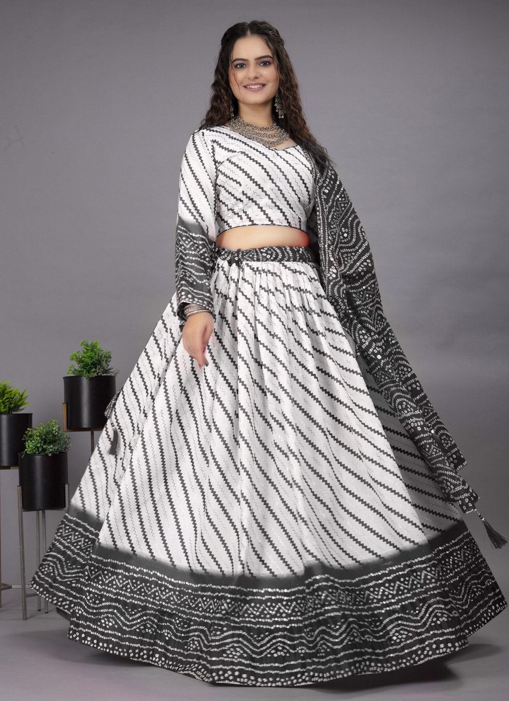Steal the spotlight by adoring this wine lehenga in *pure cotton* material  embellished with Lucknowi work also featured with beautiful hand made heavy  tassels.