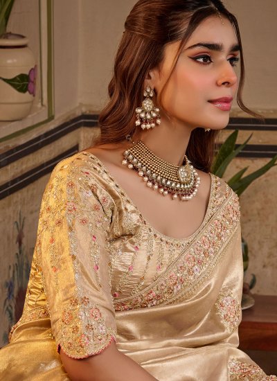 
                            Cream Embroidered Fancy Fabric Saree