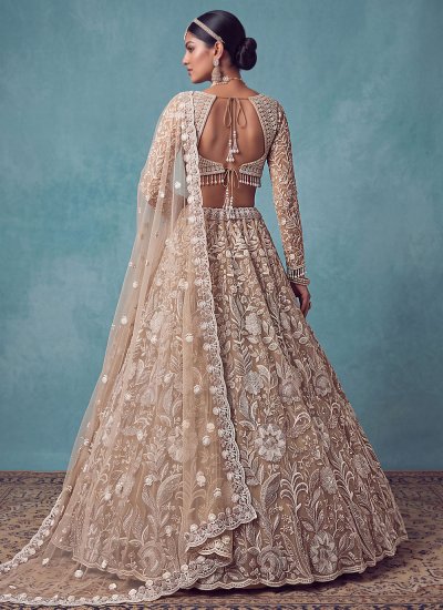 
                            Pleasing Gold Handwork Net Designer Lehenga Choli