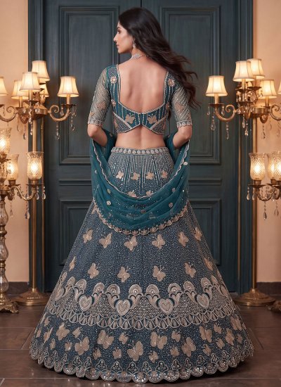 
                            Teal Net Ceremonial Designer Lehenga Choli