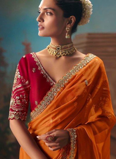 
                            Voguish Orange Embroidered Contemporary Saree